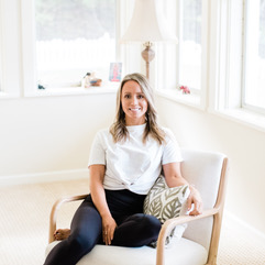 blond woman in chair