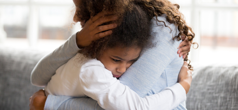 mom hugging child