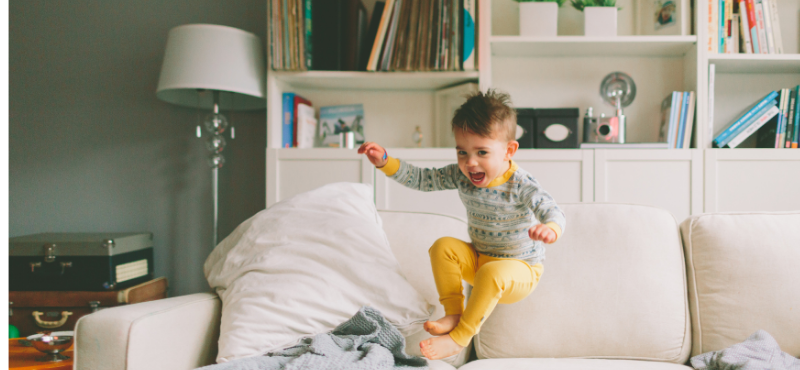 toddler jumping on couch