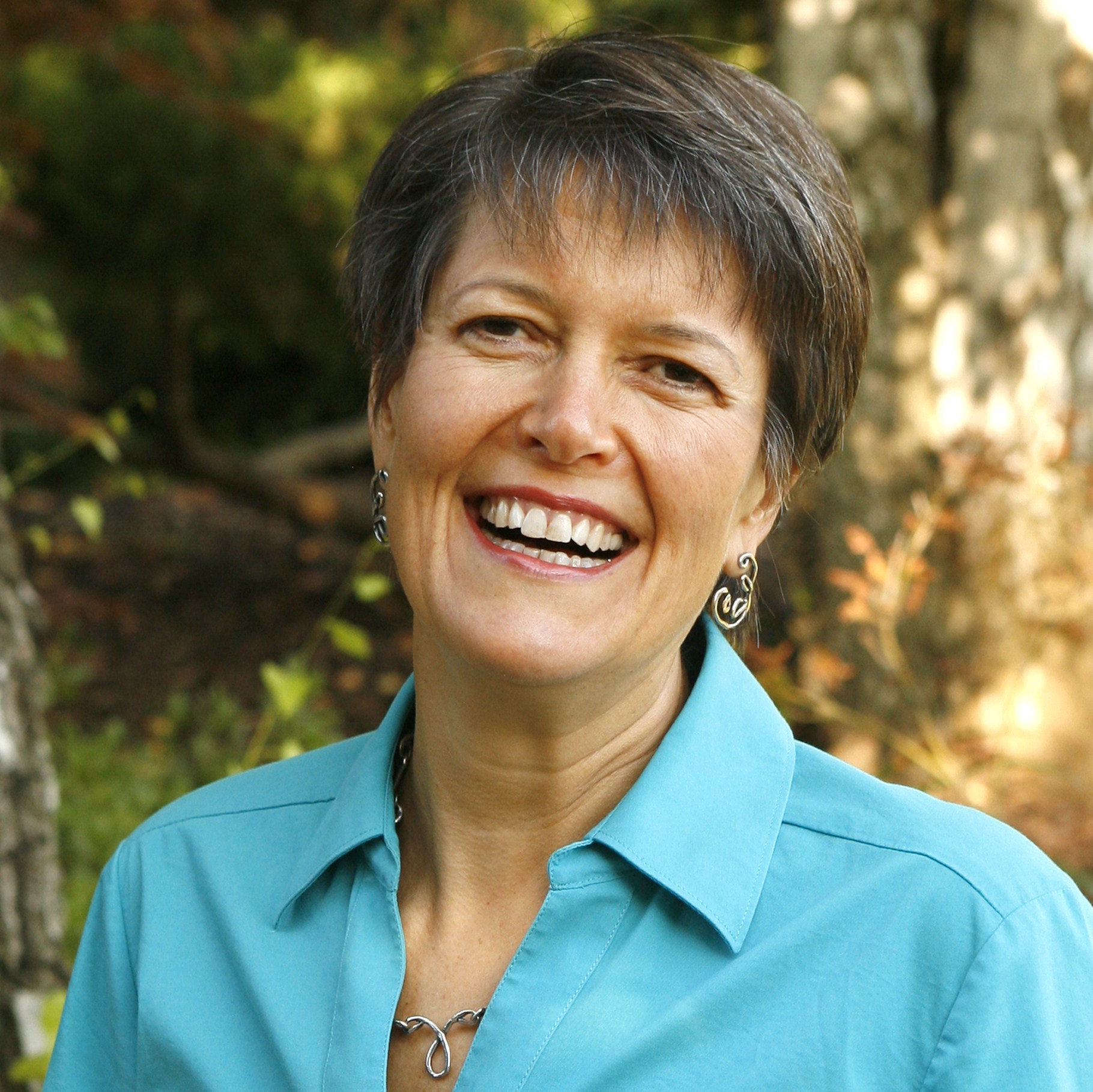 woman with short hair in turquoise